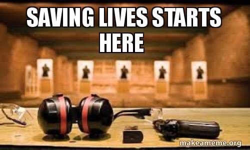 Ear protection and a handgun are displayed on a shooting range table, emphasizing safety awareness in gun handling.